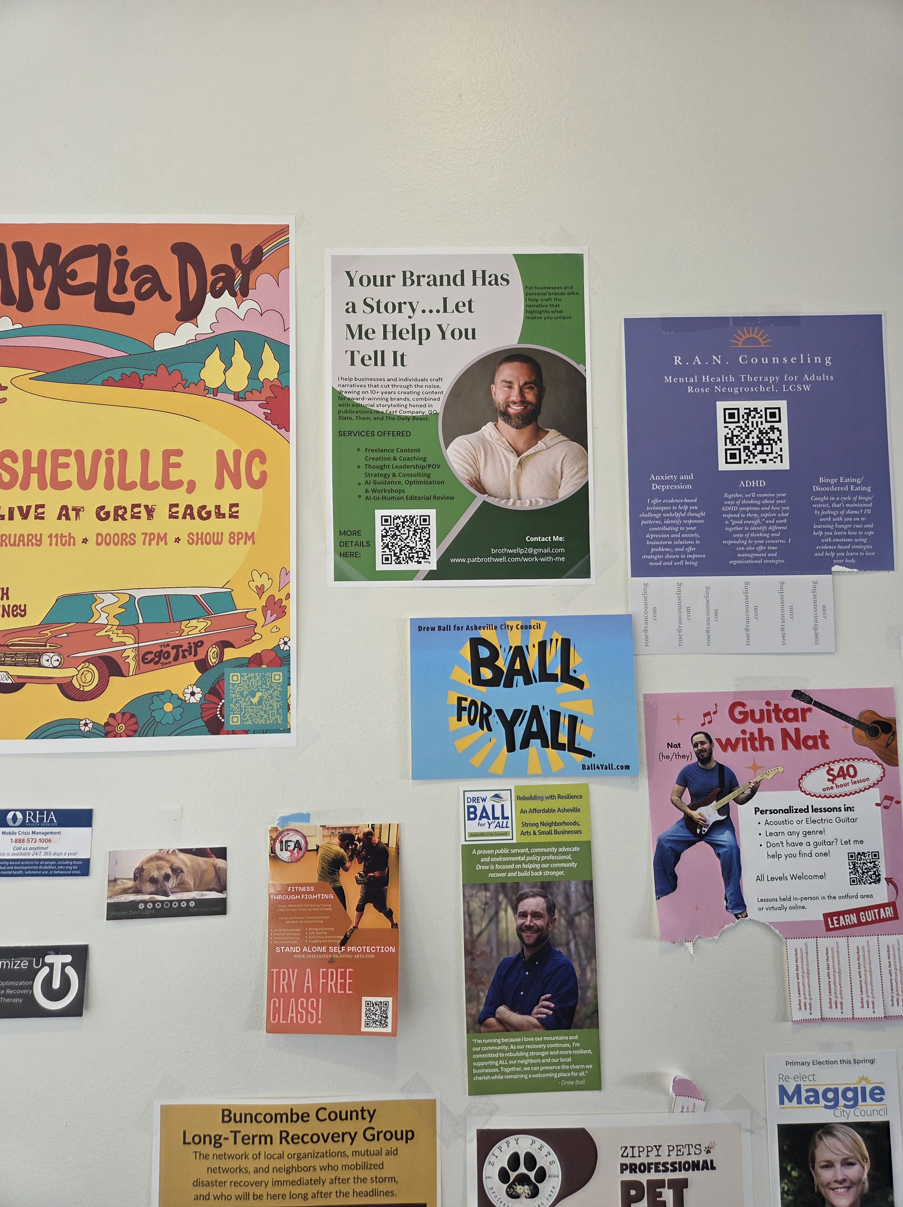 A wall full of promotional flyers at a coffee shop.